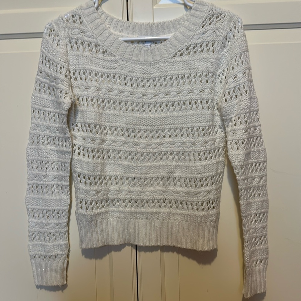Delia’s white sparkly sweater